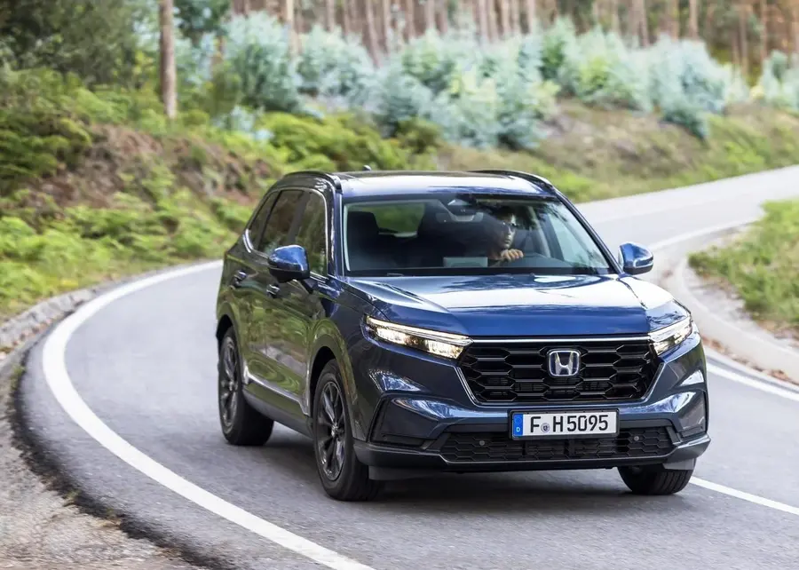 Canyon River Blue Metallic CR-V Drive in the wood