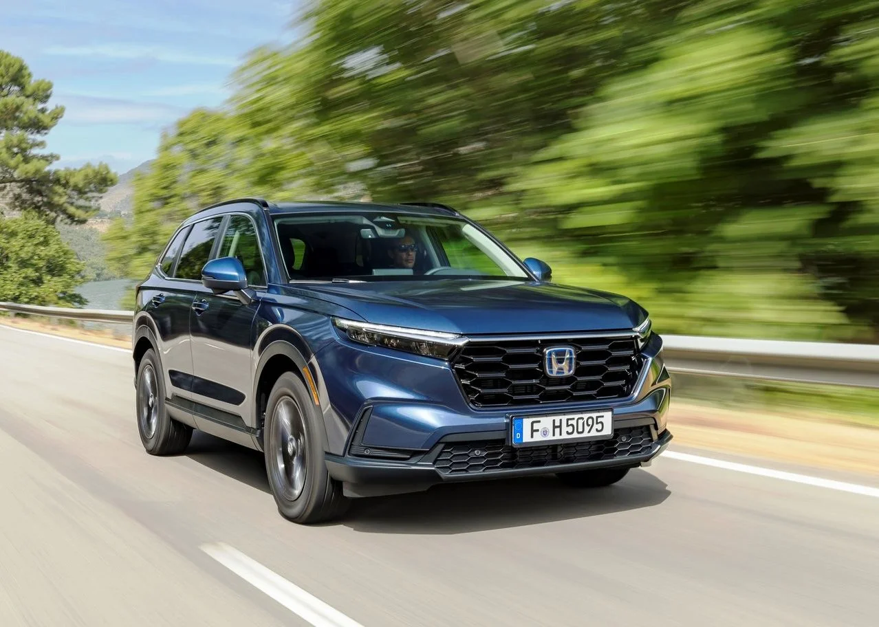 Canyon River Blue Metallic Honda CR-V Sport Hybrid on The Road