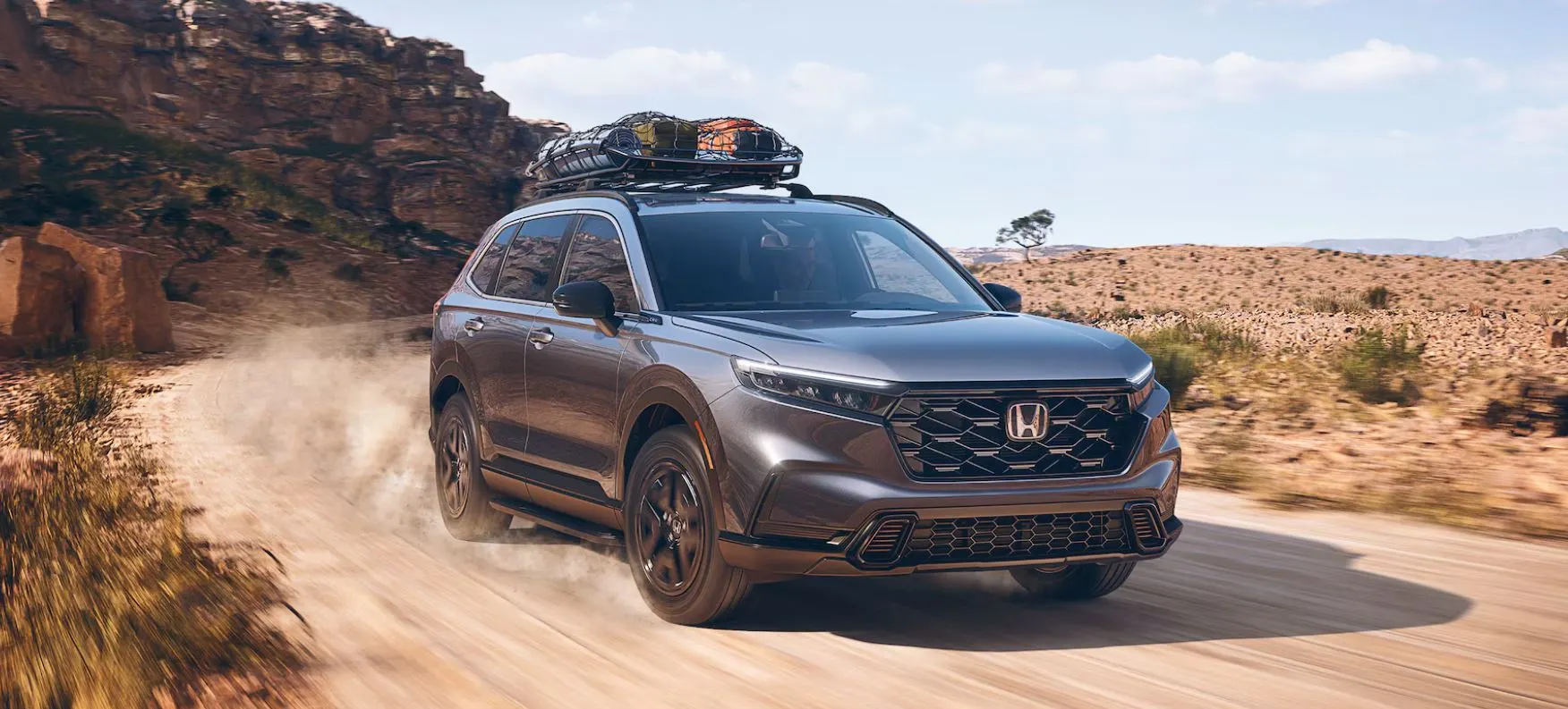 Honda CR-V Meteorite Gray Metallic With Stuff on the Roof Rack