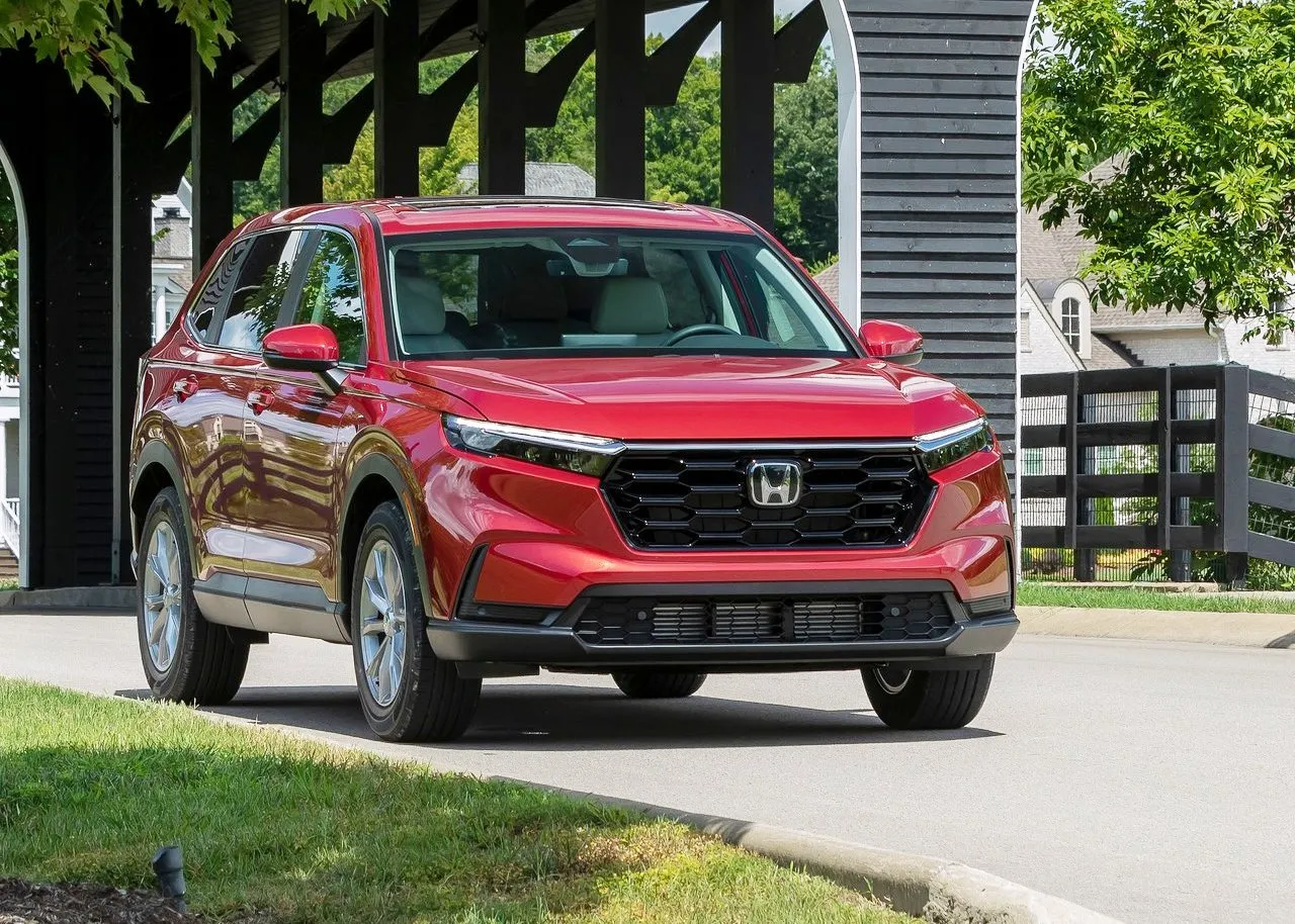 Radiant Red Metallic Honda CR-V Drive on the Park During Daylight